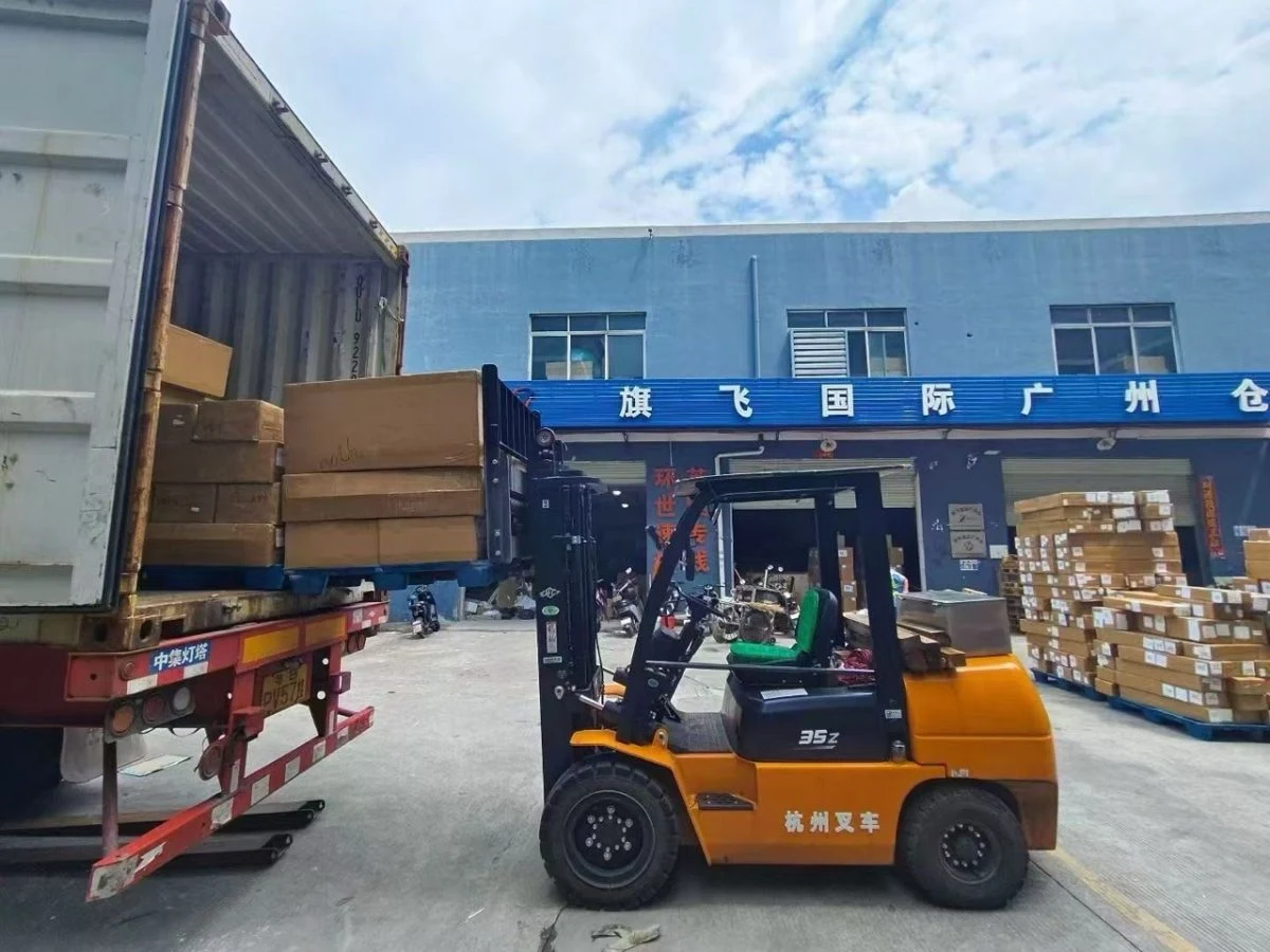 QIFLY Guangzhou warehouse team loading export cargo into a shipping container by forklift